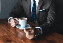 Yida Gao, Shima Capital Partners With Big Name Investors A picture of an investor drinking a cup of coffee discussing investment opportunities with Yida Gao at Shima Capital